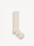 By Malene Birger Leiano ullsokker i hvit med strass-detaljer og monogramprint under foten, 70% ull og 30% polyamid.