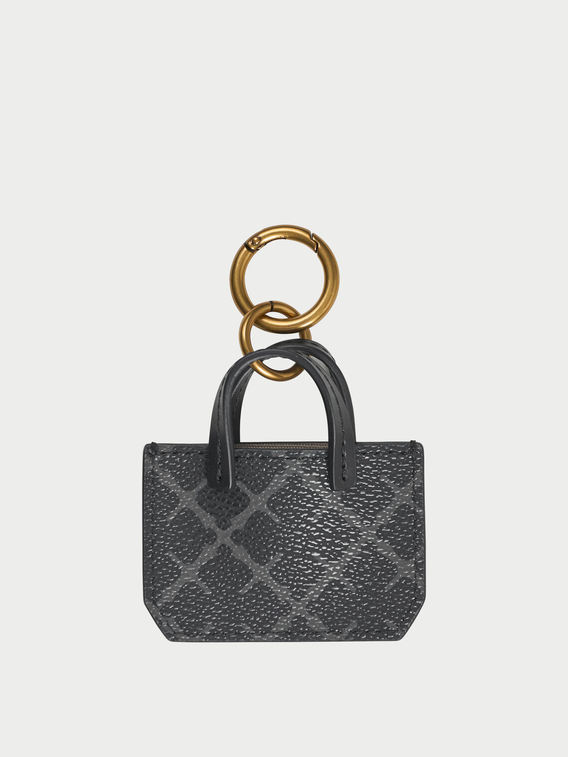 ADA CHARM nøkkelring fra By Malene Birger i fargen grå, med Signature Flower-print.