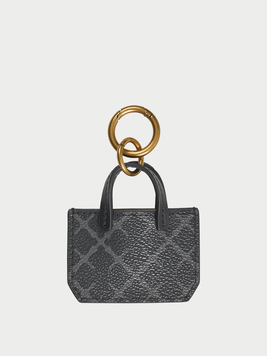 ADA CHARM nøkkelring fra By Malene Birger i fargen grå, med Signature Flower-print.
