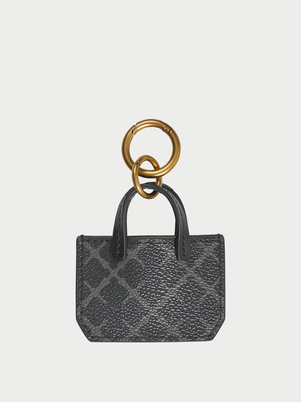 ADA CHARM nøkkelring fra By Malene Birger i fargen grå, med Signature Flower-print.