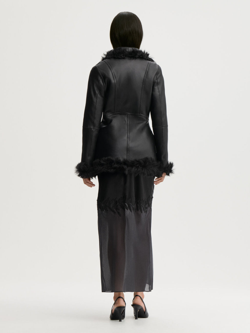 ANGELINA skjørt fra By Malene Birger i fargen sort, laget i 76% acetat og 24% polyester sateng. A-linjet silhuett med gjennomsiktig parti nederst og glidelås i siden.