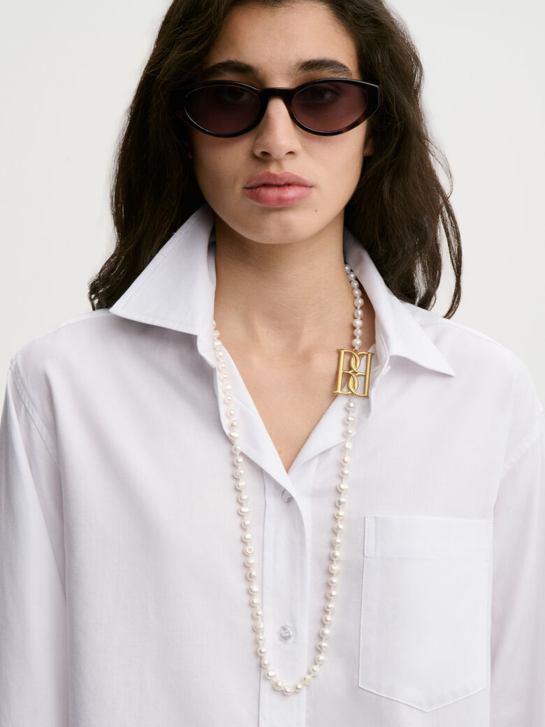 AUDREY CROPPED skjorte fra By Malene Birger i fargen hvit, laget i organisk bomull. Cropped lengde.