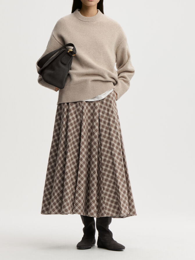 EDEN skjørt fra By Malene Birger i rutemønster, laget i 100% bomull (flanell). A-formet silhuett med lommer i siden og glidelås i siden.