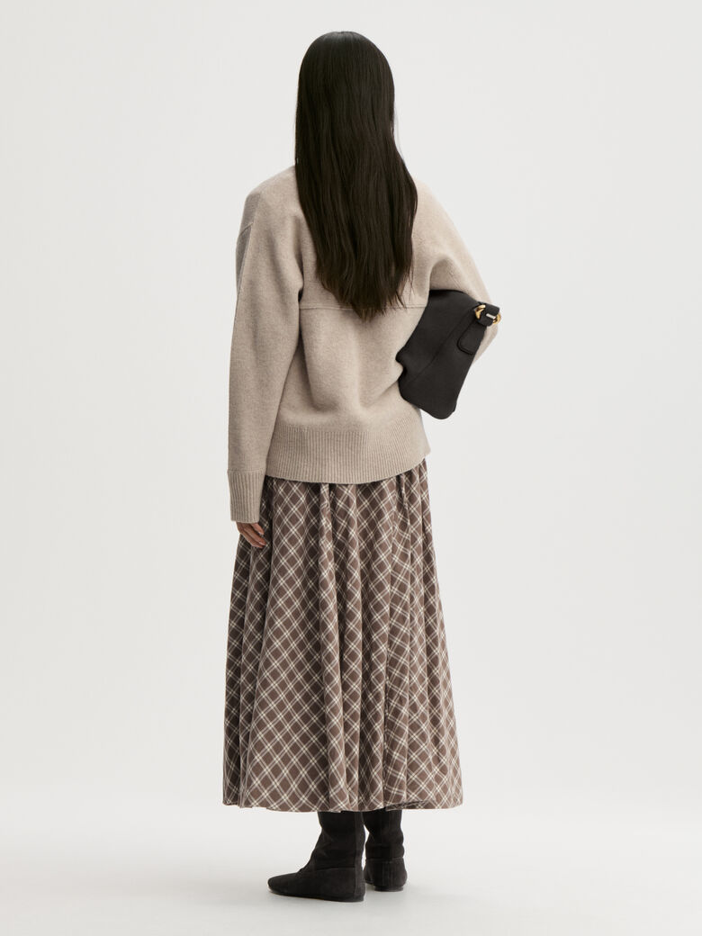 EDEN skjørt fra By Malene Birger i rutemønster, laget i 100% bomull (flanell). A-formet silhuett med lommer i siden og glidelås i siden.