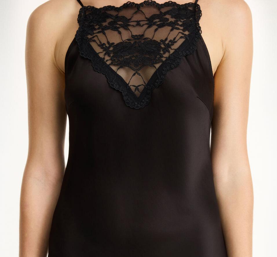 By Malene Birger Leeba topp i sort, laget av acetat og polyester, med blonde detaljer og et sensuelt, elegant uttrykk.