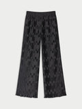 LETITA plissebukse fra By Malene Birger i fargen sort, laget i 100% resirkulert polyester. Rette ben og strikk i livet.