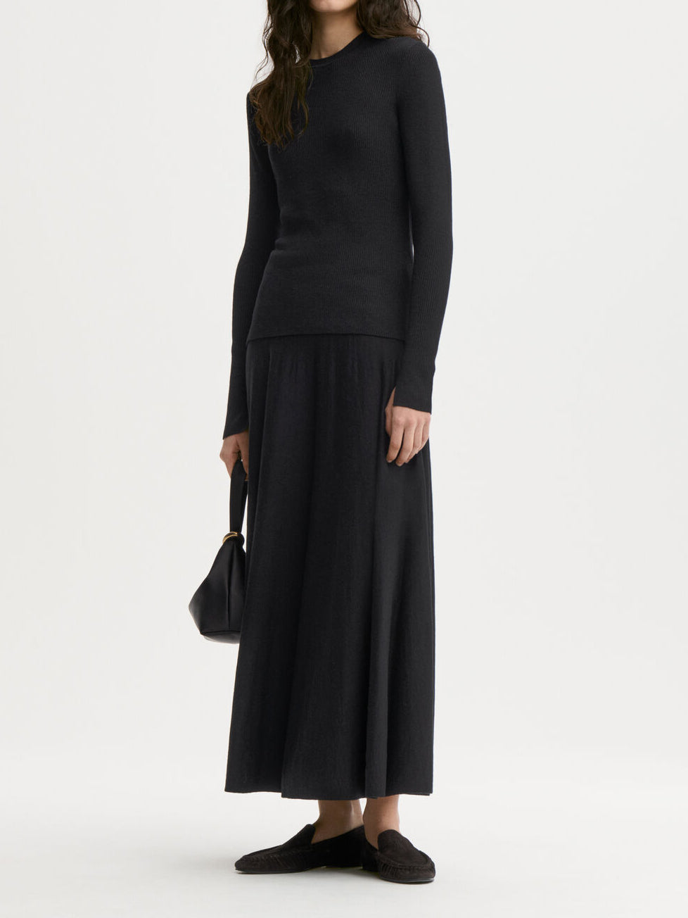 MARIELLA genser fra By Malene Birger i fargen sort, laget i 60% ull, 32% lyocell (TENCEL) og 8% silke. Ribbestrikket struktur, rund hals og tettsittende passform.