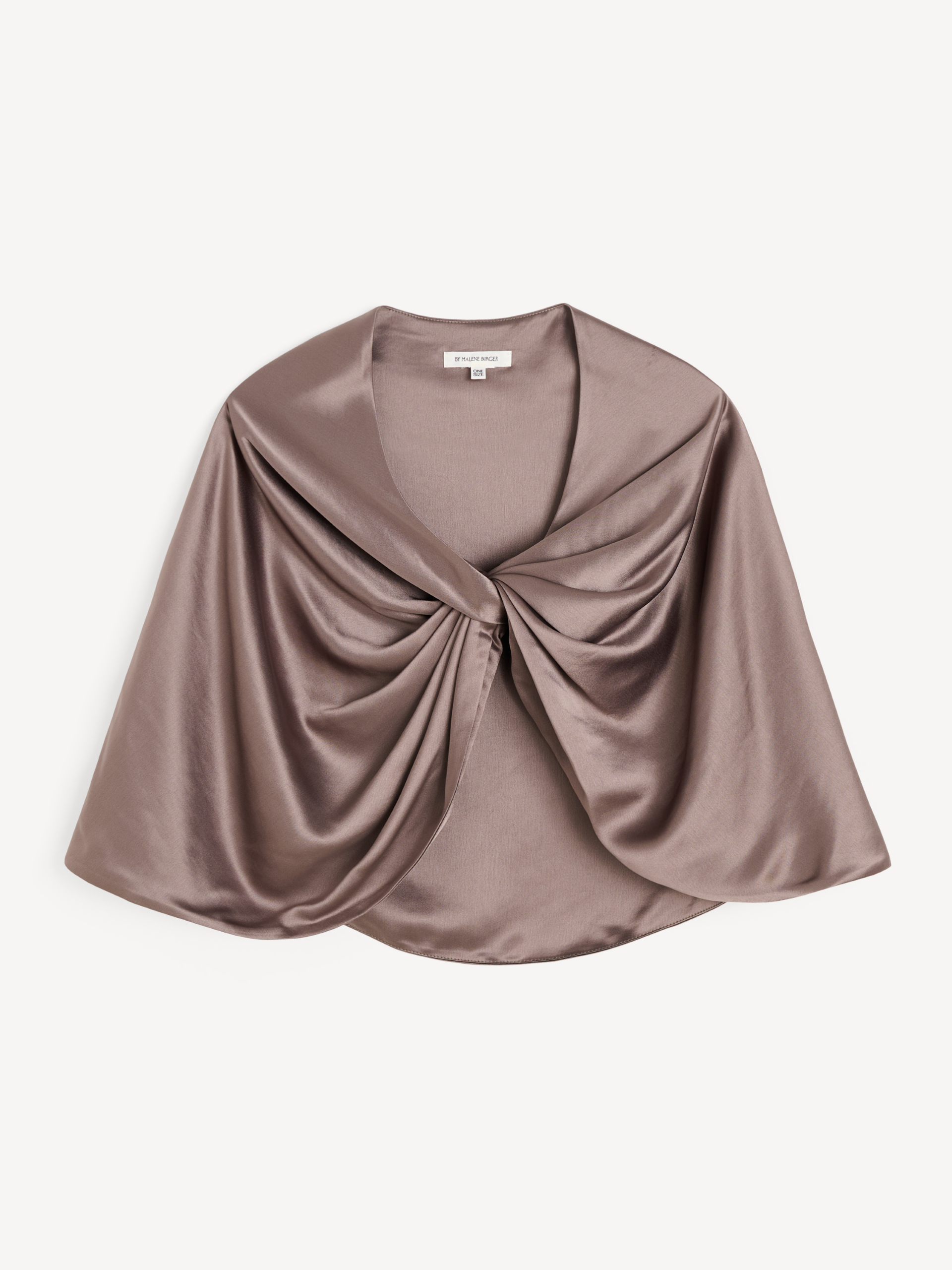 By Malene Birger PINLOS cape i brun materiale med Signatur Flower-print. Rund halsringning og lange fallende linjer.