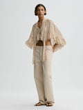 By Malene Birger CEDI cape med prikkete monogram-print. Lett og elegant materiale med rund halsringning og fallende linjer.