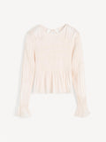 Hvit OVAS bluse fra By Malene Birger i 100% viskose med strukturstoff, dyp v-utringning bak, knyting i nakken og peplumkant.