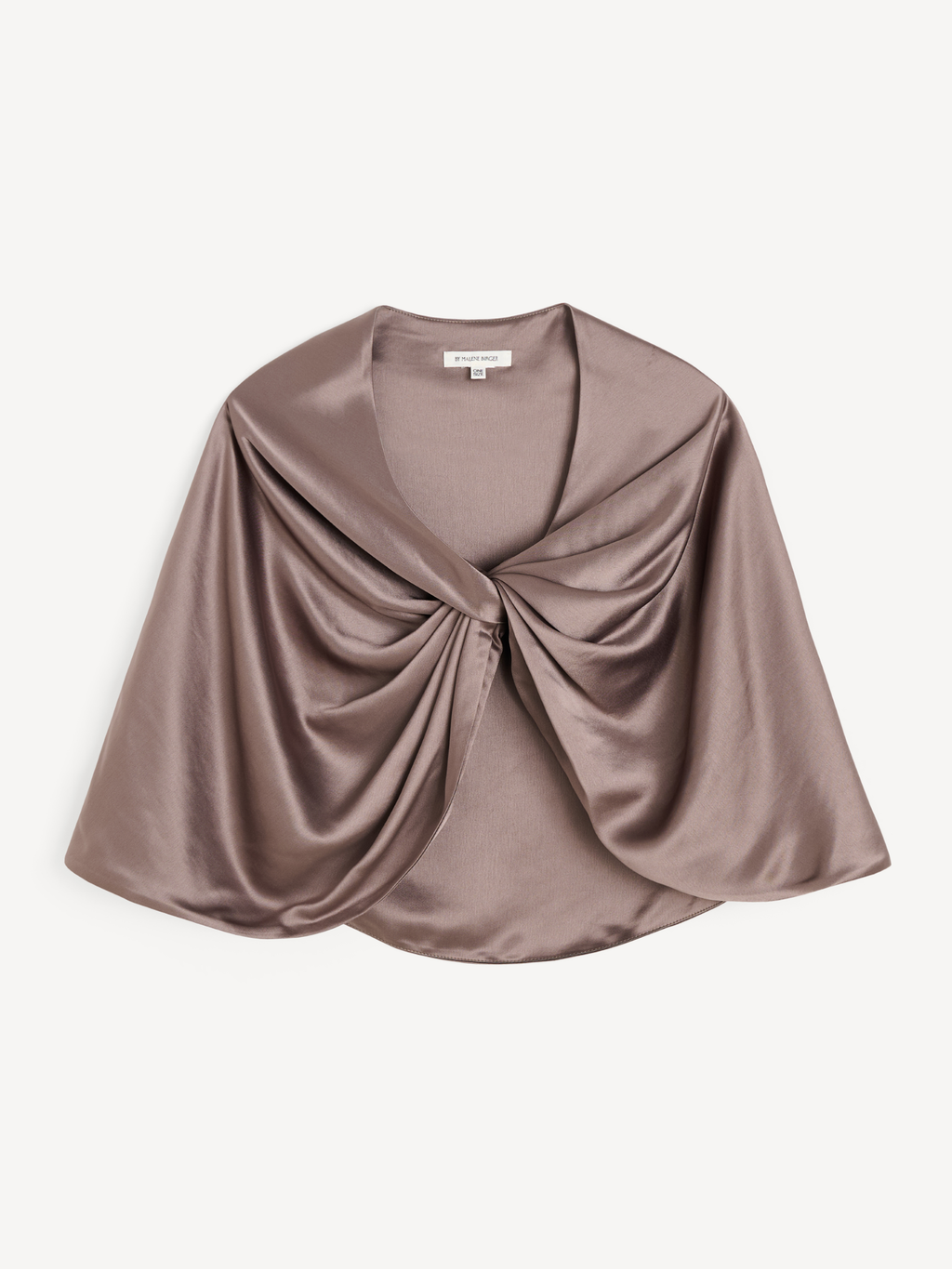 By Malene Birger PINLOS cape i brun materiale med Signatur Flower-print. Rund halsringning og lange fallende linjer.